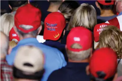  ?? Photograph: Jeff Kowalsky/AFP/Getty Images ?? Attendees listen to Donald Trump speak at a rally in Warren, Michigan, on 1 October 2022.