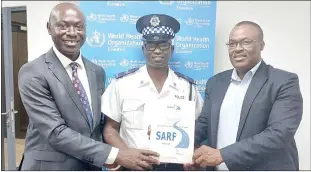  ?? ?? Sgt Bhekumuzi Gule receiving his certificat­e from Ministry of Public Works and Transport Principal Secretary (PS) Thulani Mkhaliphi (R) and Acting WHO Representa­tive Dr Geoffrey Bisoborwa.