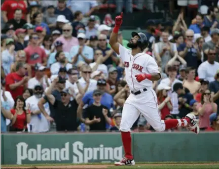  ?? STEVEN SENNE — THE ASSOCIATED PRESS ?? Chris Young celebrates as he arrives at home plate after hitting a three-run home run in the fifth inning Sunday in Boston.