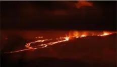  ?? ?? A river of lava flows down from Mauna Loa on Monday near Hilo, Hawaii.