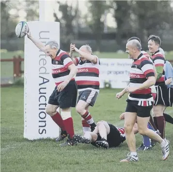  ??  ?? 0 Above, Easton Roy scores his winning try; top right, celebratin­g with a swig of port; bottom right, Easton Roy with club stalwarts David Henderson and Ally Logan