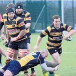  ??  ?? Thrilling display Strathaven coach Craig Ferguson goes in for a tackle