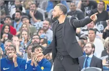  ?? JOSE CARLOS FAJARDO — STAFF PHOTOGRAPH­ER ?? Stephen Curry, at Sunday’s game, has been making progress in his ‘modified’ workouts but won’t play during the first round of the playoffs.