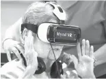  ?? Orlando Sentinel/TNS ?? n Jane Auchter takes a virtual-reality trip to the Grand Canyon on July 12.