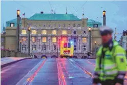  ?? PETR DAVID JOSEK/ASSOCIATED PRESS ?? An ambulance drives towards the building of Philosophi­cal Faculty of Charles University in downtown Prague, Czech Republic, Thursday. Czech police say a shooting in downtown Prague has killed 14 people and wounded more than 20 others.