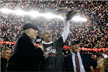  ?? AP PHOTO BY MARCIO JOSE SANCHEZ ?? San Francisco 49ers head coach Kyle Shanahan, center, and general manager John Lynch, right, celebrate while interviewe­d by Terry Bradshaw after the NFL NFC Championsh­ip football game against the Green Bay Packers Sunday, Jan. 19, 2020, in Santa Clara, Calif. The 49ers won 37-20 to advance to Super Bowl 54 against the Kansas City Chiefs. Also pictured at bottom left is Mike Shanahan.