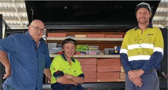  ?? Photo: Ebony Graveur ?? NEW TRAJECTORY: Kody Slattery (centre) has already found work following his 18-week apprentice­ship at the Toowoomba and Lockyer Valley Kart Club, with the help of Tom Kenneally (left) and Tim Hilton (right).