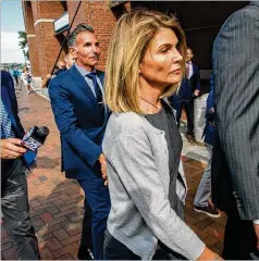  ?? JOSEPH PREZIOSO / AFP / GETTY IMAGES / TNS 2019 ?? Actress Lori Loughlin and her husband, Mossimo Giannulli, agreed to a plea deal that includes time in prison