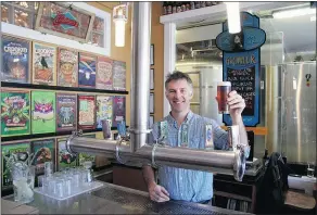  ?? JAN ZESCHKY/PNG ?? Matt Phillips, founder of Phillips Brewing Company, raises a glass in the tasting room of his Victoria brewery.