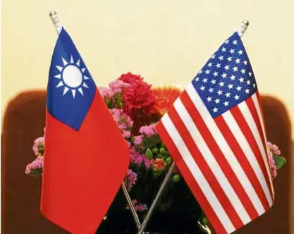  ?? —REUTERS ?? BEST FRIENDS FOREVER The US and Taiwanese flags are displayed side by side during the recent visit of Rep. Ed Royce, chair of the US House foreign affairs committee. The United States has no formal ties with Taiwan but is bound by law to help the self-ruling democratic island defend itself. China, however, sees Taiwan as part of its territory to be reunified by force if necessary. China and Taiwan split in 1949 after the communist victory in the civil war.