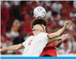  ?? ?? Belgium’s midfielder #06 Axel Witsel and Morocco’s midfielder #15 Selim Amallah (front) jump to head the ball during the Qatar 2022 World Cup Group F football match between Belgium and Morocco.