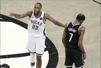  ?? AP photo ?? The Bucks’ Khris Middleton calls to teammates after the Nets’ Kevin Durant missed a shot during overtime of Milwaukee’s 115-111 win Saturday.