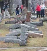  ?? (Tom Gannam/Reuters) ?? THESE HEADSTONES were among those vandalized last weekend in the Chesed Shel Emeth Cemetery in University City, a suburb of St. Louis, Missouri.