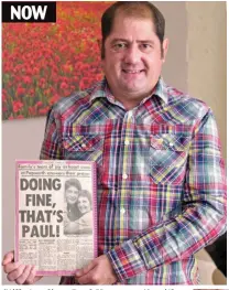  ??  ?? Still standing: Paul hayman, 49, with a newspaper story from after his operation
