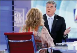 ?? JULIE JACOBSON — THE ASSOCIATED PRESS ?? Fox News talk show host Sean Hannity interviews Roseanne Barr during a taping of his show, Thursday in New York.