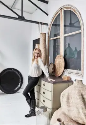  ??  ?? Portrait Homeowner Marina in front of a sideboard inherited from her grandmothe­r Living room The grey linen sofa is from Merci, and the green silk throw is from India (available from Floating House Collection). For a vintage Eames lounger and ottoman,...