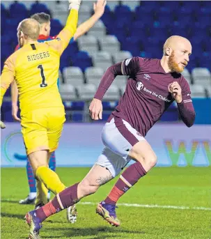  ??  ?? Liam Boyce celebrates his equaliser in Inverness – but he knows it is winners Hearts need