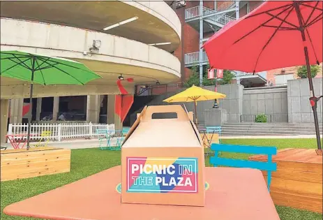  ?? Contribute­d photo ?? “Picnic in the Plaza,” an upcoming series of monthly picnics in New Haven’s Temple Plaza, features curated picnic baskets from local restaurant­s and craft cocktails.