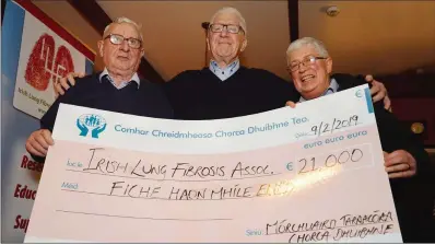  ?? Photo by Declan Malone ?? Michael Geoghegan (centre), representi­ng the Irish Lung Fibrosis Associatio­n, with Seamus Devane and John Patrick O’Sullivan in the Marina Inn on Saturday night, where he was presented with a cheque for €21,000, raised at the charity tractor run around West Kerry last November.