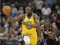  ?? ?? Golden State Warriors forward Draymond Green (23) starts a fast break during the first quarter against the Sacramento Kings in Sacramento on Sunday.