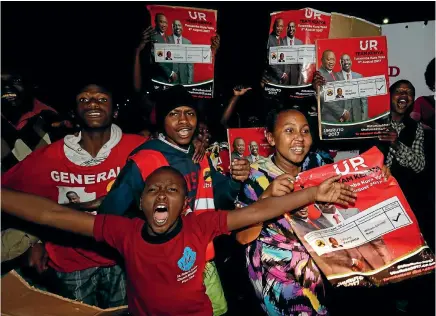  ?? REUTERS ?? Supporters of Kenya’s President Uhuru Kenyatta celebrate at the national tallying centre in the capital, Nairobi, after he was confirmed as the winner of the country’s disputed presidenti­al election.