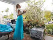  ?? K.C. ALFRED U-T ?? Soprano Victoria Robertson sings from the porch of her North Park home on April 19.