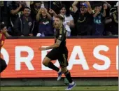  ?? RYAN SUN — THE ASSOCIATED PRESS ?? LAFC midfielder Ryan Hollingshe­ad celebrates after scoring one of his two goals against Vancouver on Oct. 28.