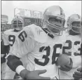  ?? BRIAN HORTON — THE ASSOCIATED PRESS ?? Oakland’s Mike Davis (36) runs off the field after intercepti­ng a pass with a few seconds left in a 1981 AFC playoff game in Cleveland. Davis, who had one of the most memorable intercepti­ons in team history, has died at 65.