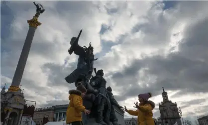  ?? Smith/ZUMA Press Wire/REX/Shuttersto­ck ?? Children play in Independen­ce Square as Kyiv remains calm despite the Russian military presence at its borders. Photograph: Bryan