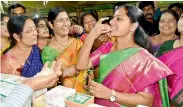  ??  ?? MP Kalvakuntl­a Kavitha tasting the organic food at the Women of India Organic Festival at Shilparama­m.