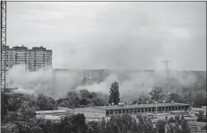  ?? NATACHA PISARENKO/AP PHOTO ?? Smoke rises after a Russian missile strike in Kyiv, Ukraine, Sunday.