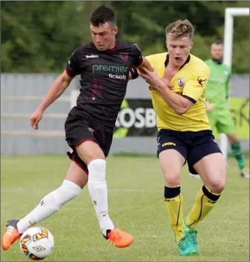  ??  ?? Wexford goalscorer Thomas Croke holds off Daniel O’Reilly of Longford Town.