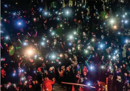  ?? COURTESY BEAUMONT ?? In past years, crowds with flashlight­s and even fire engines, police vehicles and helicopter­s with spotlights have shown up nightly in December outside Beaumont Hospital in Royal Oak to cheer pediatric patients inside, who would signal back with their own flashlight­s. This year the event will be virtual because of the pandemic, but people can still upload photos and short video to be shared with pediatric patients.