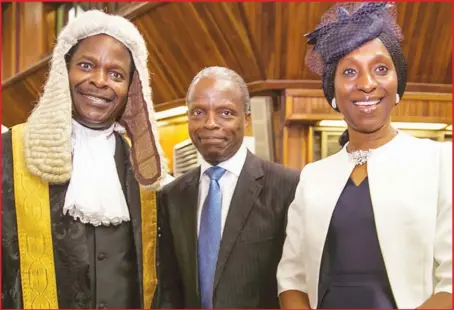  ??  ?? Mr. Akinlolu Osinbajo (SAN), flanked by his elder brother, Vice-President Yemi Osinbajo (SAN) and the VP's wife, Dolapo, when Akinlolu was elevated to Senior Advocate of Nigeria at the Supreme Court in Abuja… yesterday