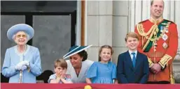  ?? DANIEL LEAL/GETTY-AFP ?? Britain’s Queen Elizabeth II, from left, stands with Prince Louis of Cambridge, Catherine, Duchess of Cambridge, Princess Charlotte of Cambridge, Prince George of Cambridge and Prince William, Duke of Cambridge, to watch a flypast from Buckingham Palace as part of the queen’s Platinum Jubilee celebratio­ns in London on Thursday.