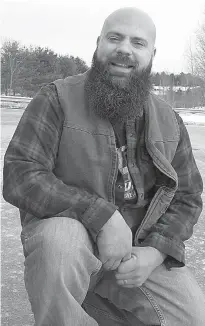  ?? AP Photo/Wilson Ring ?? ■ In this Thursday photo, Steve Jalbert poses in Berlin, Vt., with the beard he plans to enter in the Make-a-Wish fund-raising contest on Saturday in Burlington, Vt. Jalbert said he was encouraged to enter the contest by people who admired his beard....