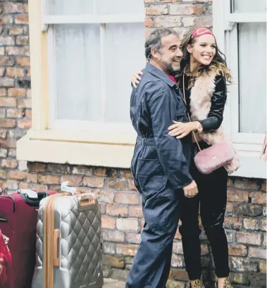  ??  ?? A scene from Coronation Street with, from left, Michael Le Vell as Kevin Webster, Helen Flanagan as Rosie Webster, Brooke Vincent as Sophie Webster, and Debbie Rush as Anna Windass.