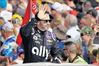  ?? [CHRIS O'MEARA/ THE ASSOCIATED PRESS] ?? Jimmie Johnson waves to fans during driver introducti­ons before the NASCAR Daytona 500 auto race on Sunday. Johnson is making his last Daytona 500 start.