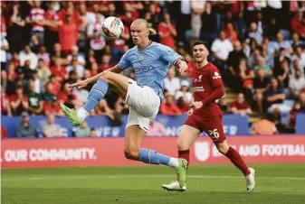  ?? Mike Hewitt / Getty Images ?? Manchester City’s Erling Haaland controls a pass Saturday against Liverpool FC in Leicester, England. Haaland was the transfer of the summer from the Bundesliga’s Borussia Dortmund.