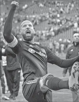  ?? Stephen Brashear Getty Images ?? LAURENT CIMAN, shown celebratin­g a victory, says he’s happy with LAFC. “This club is like a family and it’s something I was looking for,” the defender said.