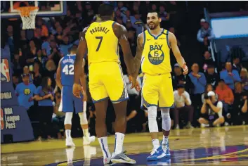  ?? ANDA CHU — BAY AREA NEWS GROUP FILE ?? The Golden State Warriors’ Eric Paschall (7) and Mychal Mulder (15) celebrate in the fourth period against the Philadelph­ia 76ers at Chase Center in San Francisco on March 7.