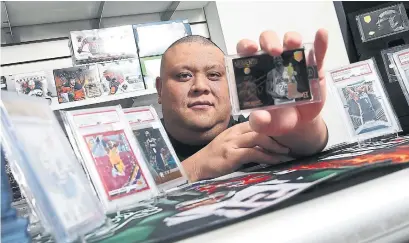  ?? RENÉ JOHNSTON TORONTO STAR ?? Rey Revereza, co-owner of Dolly’s Sports Cards in Toronto, says generation­al sports stars help drive the market for trading cards.