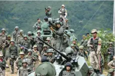  ?? — AFP ?? Venezuelan troops in different fatigues and carrying various weapons attend the press conference given by Defence Minister General Vladimir Padrino Lopez at Fort Tiuna in Caracas.