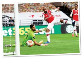  ??  ?? FINISHING TOUCH: Alexandre Lacazette drives home Arsenal’s second to seal the win and (right) Bukayo Saka after the opener