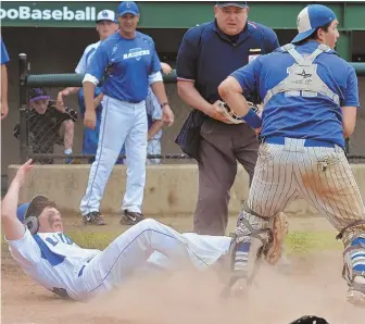  ?? STAFF PHOTOS BY CHRIS CHRISTO ?? NEEDED LIFT: Above, Dover-Sherborn’s Jonathan Musgrave was out at the plate via a tag from Auburn catcher Brian Sarkisian during yesterday’s Division 3 state final in Worcester. Three late runs gave Auburn and Sarkisian (right) the title, something big...