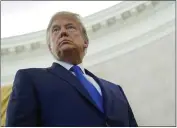  ?? PATRICK SEMANSKY — THE ASSOCIATED PRESS ?? President Donald Trump listens to a reporter’s question in the Oval Office of the White House in Washington on Monday.