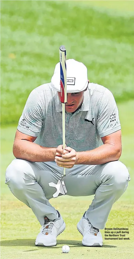  ??  ?? Bryson DeChambeau lines up a putt during the Northern Trust tournament last week.