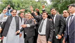  ??  ?? Lawyers shout “go Nawaz go” following proceeding­s on corruption allegation­s case against Prime Minister Nawaz Sharif’s family in Islamabad. — AP