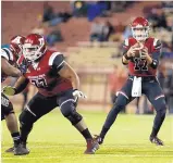  ?? ANDRES LEIGHTON/FOR THE JOURNAL ?? New Mexico State quarterbac­k Tyler Rogers, who has been battling an injured shoulder, ranks third nationally in completion­s per game with 27.9 and sixth in total offense a game with 339.8 yards.