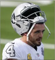  ?? HARRY HOW — GETTY IMAGES ?? The Raiders will have to determine if Derek Carr, who strained his groin in last week’s loss to the Chargers, is healthy by Saturday.